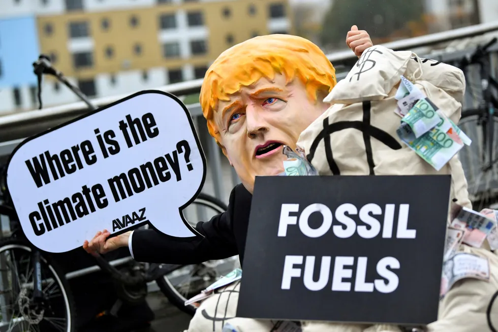 Demonstration: a person wearing a mask depicting Britain's Prime Minister Boris Johnson protests during the UN Climate Change Conference (COP26) in Glasgow on 12 November