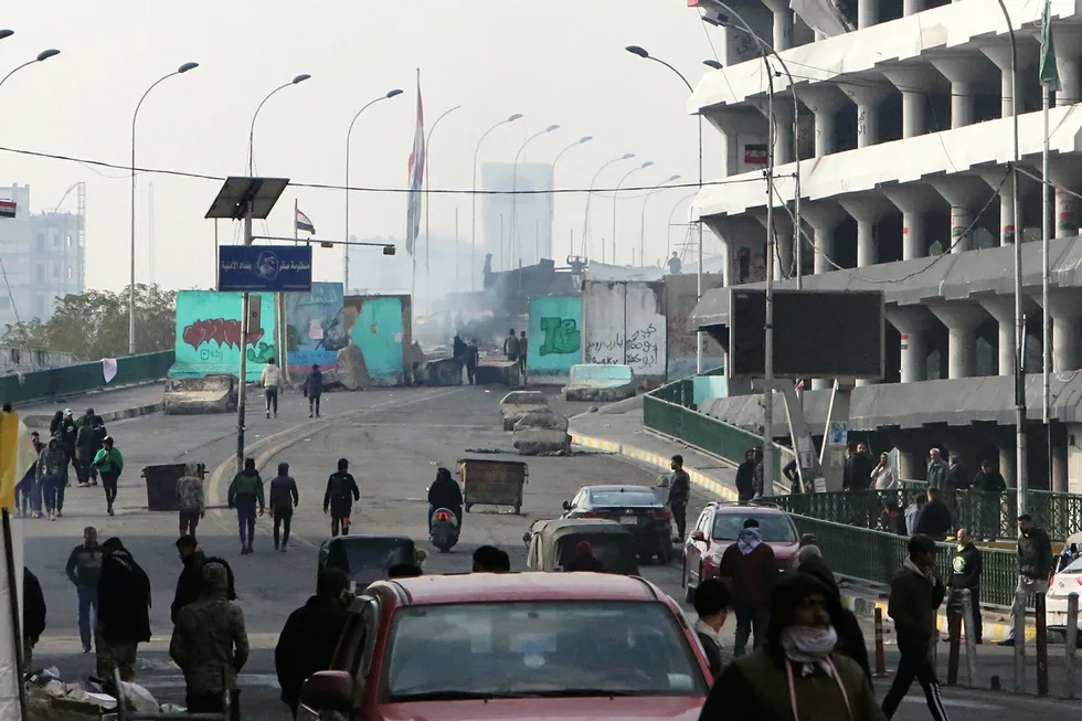 Unrest continues: Iraqi anti-government protesters gather at al-Sinek bridge in the capital Baghdad on January 25