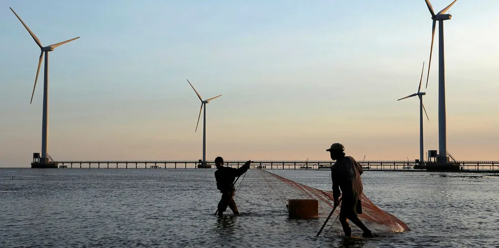 Fishermen working near the 100MW Bac Lieu wind farm on the coast of Vietnam, one of the countries that will benefit from IFC-World Bank offshore wind funding
