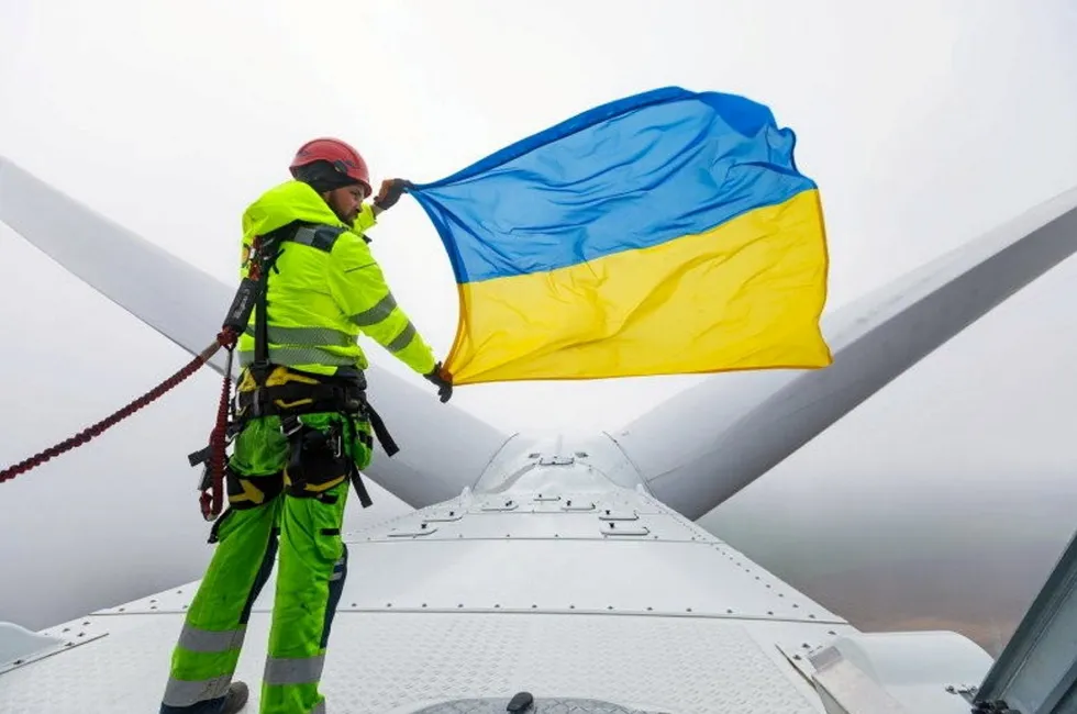 An engineer stands on top of a Vestas wind turbine at DTEK's Tyligulska wind project.