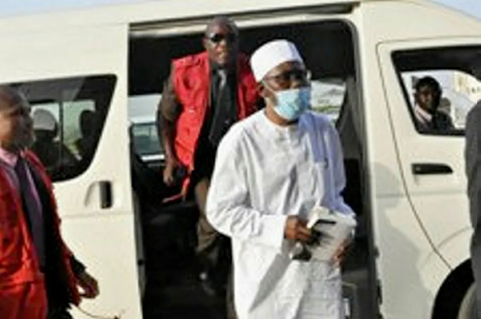 Charged: Former Nigeria attorney general Mohammed Adoke (front) escorted by security in December 2019