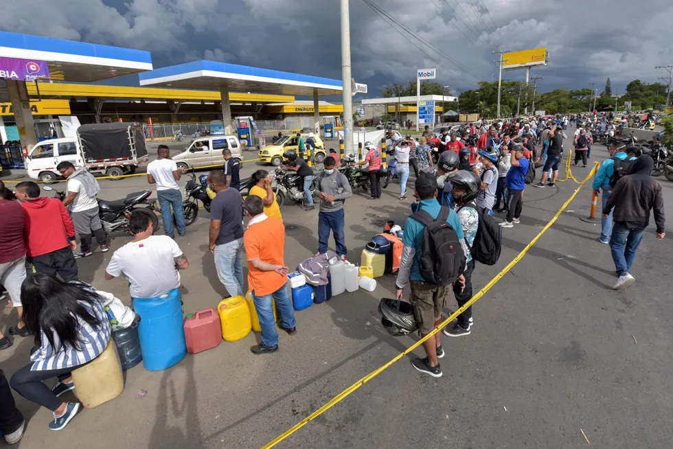 Unrest: Colombians line up to buy gasoline during a fuel shortage following more than a week of violent protests