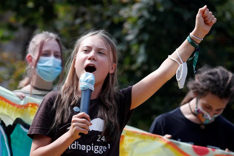 Calling for action: climate activist Greta Thunberg speaks as she joins students in Milan holding a Fridays for Future climate strike while environment ministers meet ahead of Glasgow's COP26 meeting
