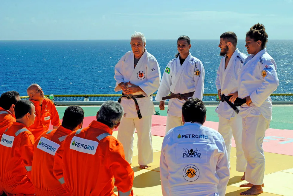PetroRIo workers meet Judo master and Brazilian gold medalist Flavio Canto and youngsters from Instituto Reacao NGO on board the Polvo platform in Brazil's Campos basin in an event intended give PetroRio offshore workers contact with the work done by the NGO. The NGO, which has Canto has one of its directors, teaches judo in the favela slums of Rio de Janeiro, teaching young people discipline and training potential champions Received July 2017. Photo: GARETH CHETWYND