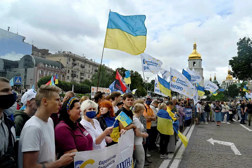 Court challenge: supporters of former Ukrainian President Pyotr Poroshenko rally outside a court building during a hearing to consider a request to put ex-president under arrest in Kiev in July 2020