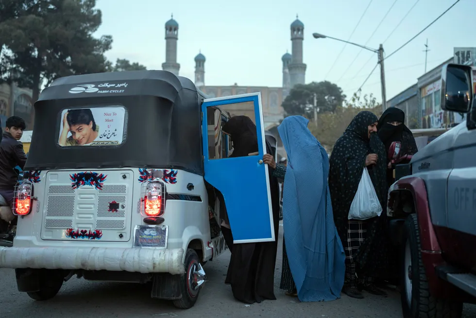 Looking for a ride: women get in a taxi near the Blue Mosque in the city of Herat in Afghanistan, which is a first major transit point in the country for the Tapi gas pipeline