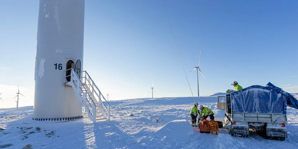 Servicing European wind farm in icy conditions.