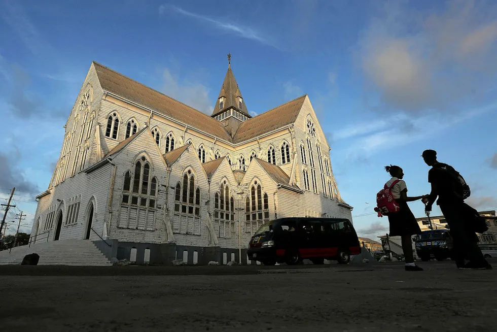 Home town: people stand near the St George’s Anglican Church in Georgetown, Guyana