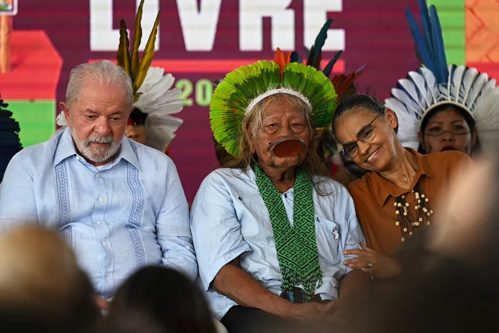 Split: Brazilian President Luiz Inacio Lula da Silva (left) and Brazilian Minister for the Environment & Climate Change Marina Silva (right) flank an indigenous leader at an event in Brasilia in April.