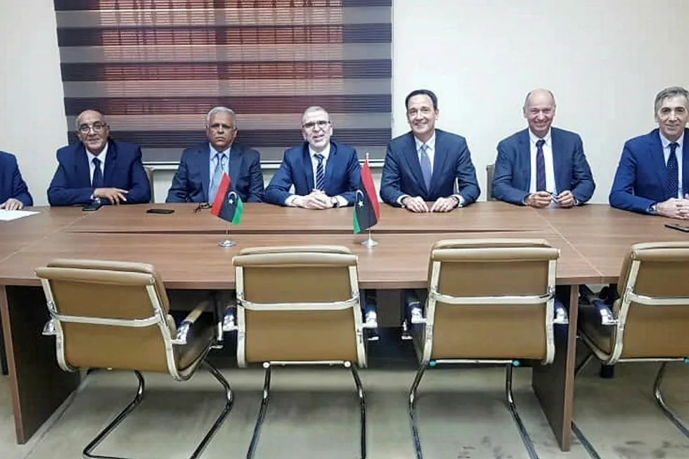 NOC chairman Mustafa Sanalla (centre) at the Waha signing ceremony with colleagues plus executives from Total.