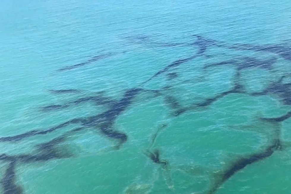 Oil spill: A ship sails during an oil spill in Las Palmas beach in Balao, Ecuador.