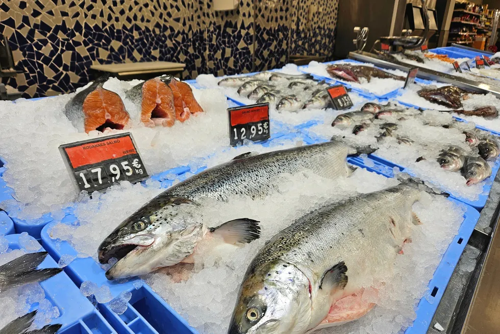 Fresh farmed salmon sits on ice in a Barcelona fish market. Prices for the fish have collapsed in recent weeks.