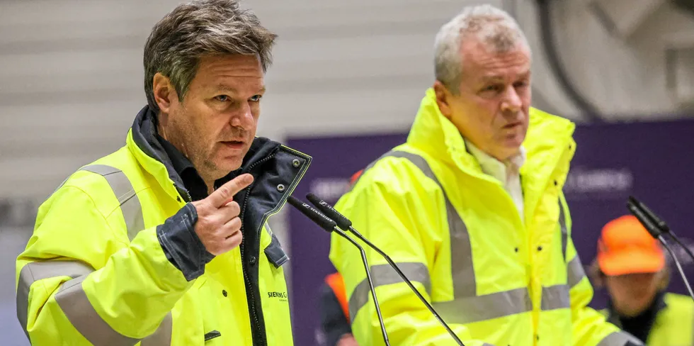 German Minister of Economics and Climate Protection Robert Habeck (L) and the CEO of Siemens Gamesa Jochen Eickholt give a statement during Habeck's visit at the OEM's factory in Cuxhaven.