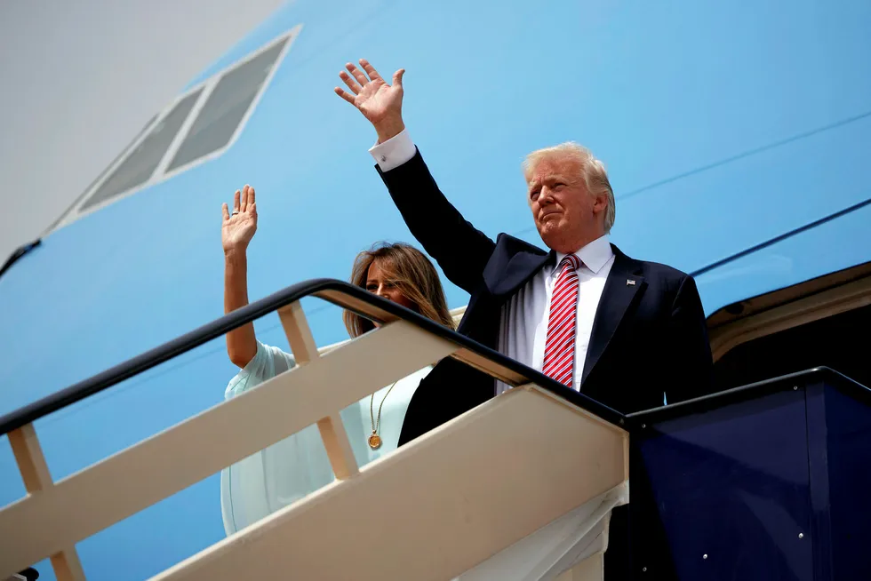 On tour: US President Donald Trump (right) and First Lady Melania Trump wave as they board Air Force One for Israel, the next stop in Trump's international tour, at King Khalid International Airport