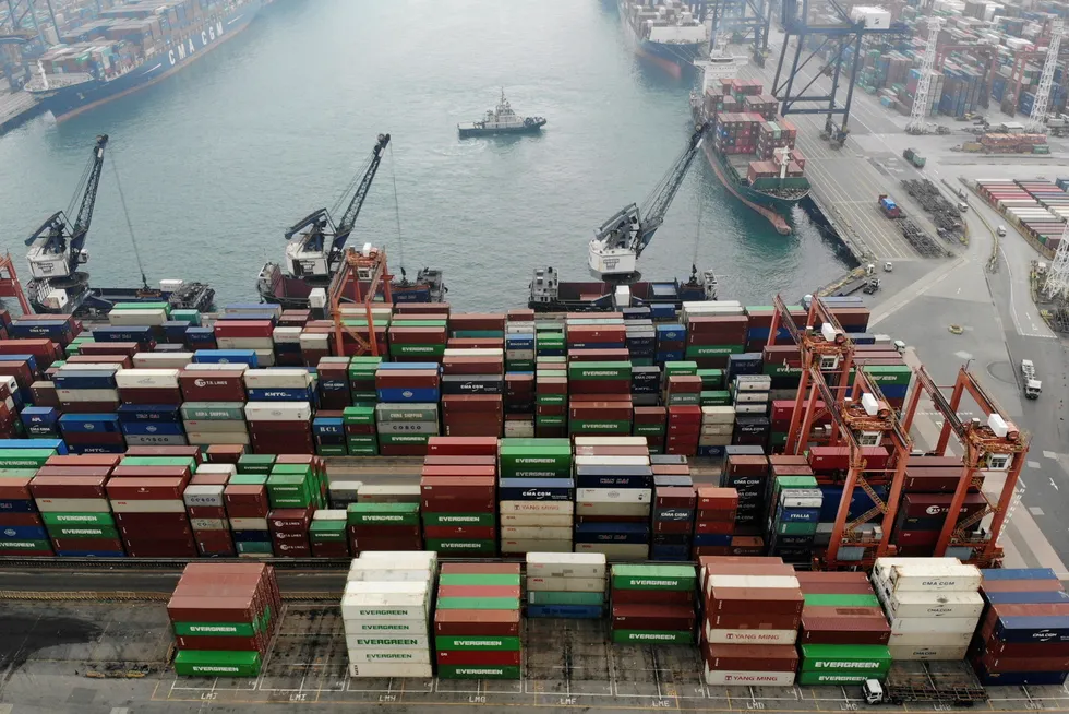 Global shipping rates have returned largely to pre-pandemic levels after increasing by more than five times during the lockdowns. An aerial view shows containers and ships at the Kwai Chung Container Terminal in Hong Kong, China.
