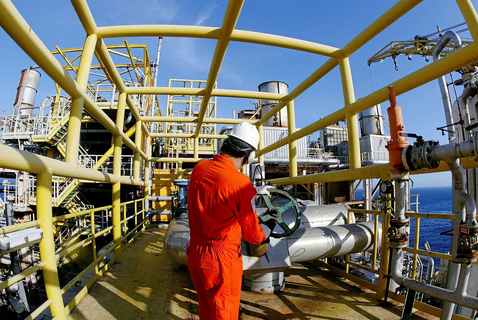 Tapping in: Petrobras workers on board the P-37 FPSO at the Marlim field off Brazil