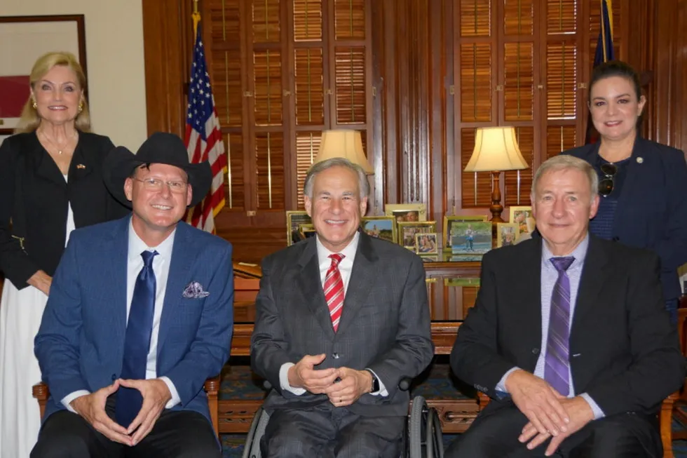 Funding: Texas Governor Greg Abbott (seated, centre) supports Scottsdale, Arizona-based USA BioEnergy's plans to build a renewable fuels plant in East Texas