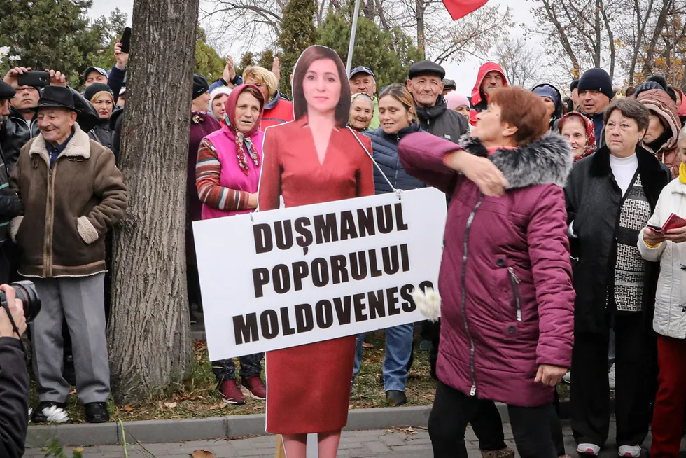Rising tensions: A woman slaps a cardboard cutout of Moldova’s pro-western President Maia Sandu during a recent protest in the country’s capital of Chisinau