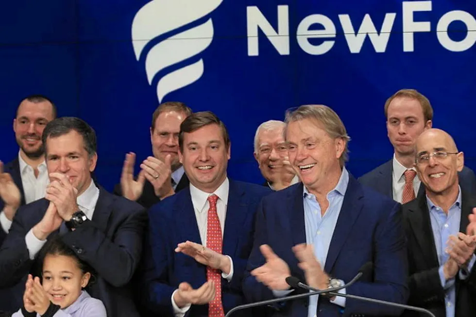 Good times: New Fortress Energy founder and chief executive Wes Edens (centre-right) at the New York Stock Exchange in 2019