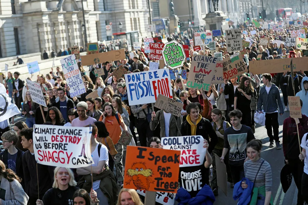 People take part in a "youth strike for climate change" demonstration in London