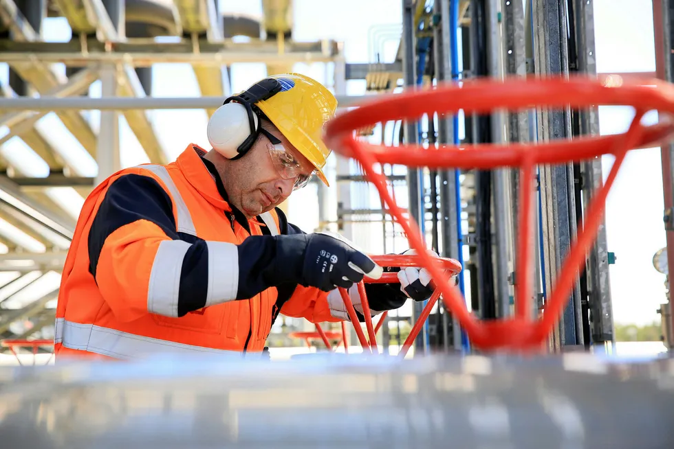 Delay: a worker at the Bellanaboy Bridge Gas Terminal in Mayo, Ireland, that handles gas from Shell's Corrib project