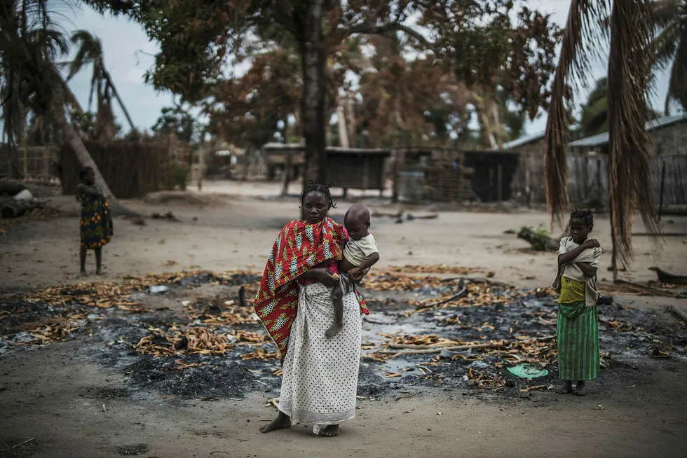 Insurgency: Attacks by extremist Islamists in Cabo Delgado, Mozambique have increased year on year since starting in late 2017. A woman holds her younger child while standing in a burned out area in a village outside Macomia that was targeted in mid-2019.