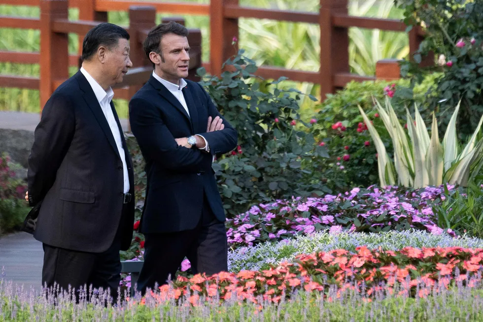 Dialogue: Chinese President Xi Jinping (left) and French President Emmanuel Macron speak as they visit the garden of the residence of the Governor of Guangdong last week during the latter's state visit to China.
