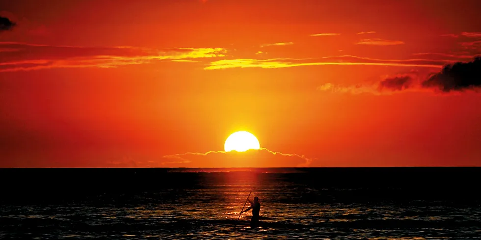 The sunset from Waikiki beach in Honolulu, Hawaii