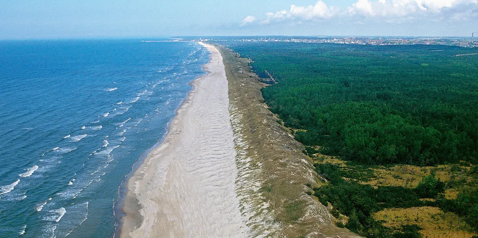 Aerial view of the Curonian Spit, with the city of Klaipeda in the background, Lithuania.