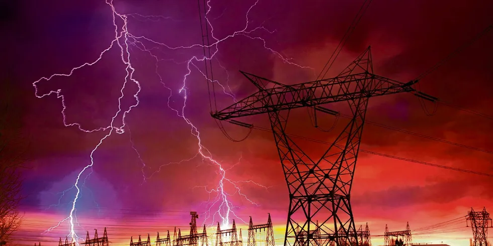 Dramatic Image of Power Distribution Station with Lightning Striking Electricity Towers
