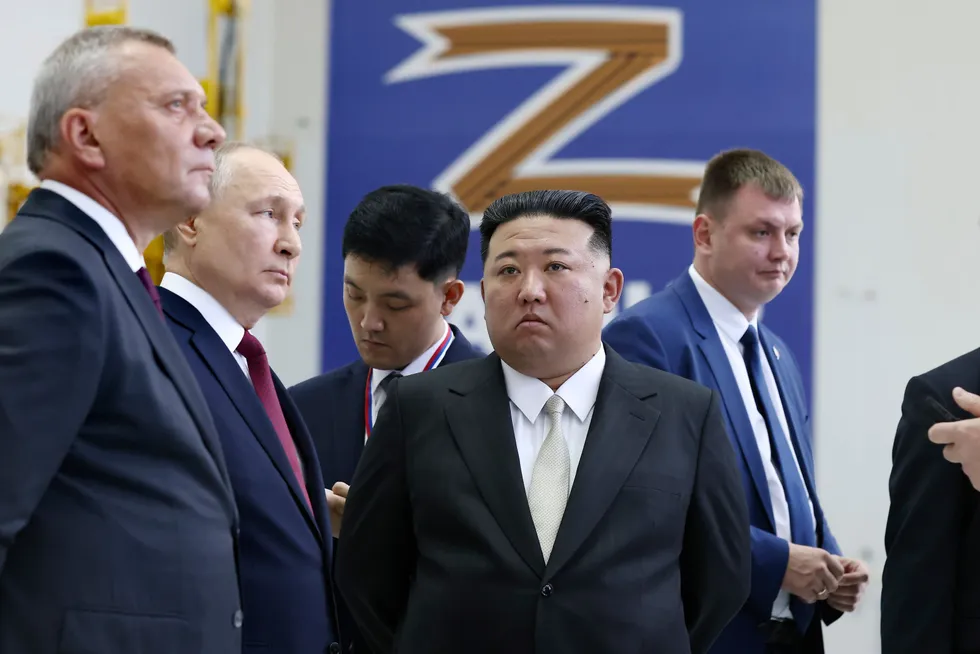 Payback: Russian President Vladimir Putin and North Korea's Kim Jong Un tour a rocket assembly hangar in Russia’s Far East in September this year.