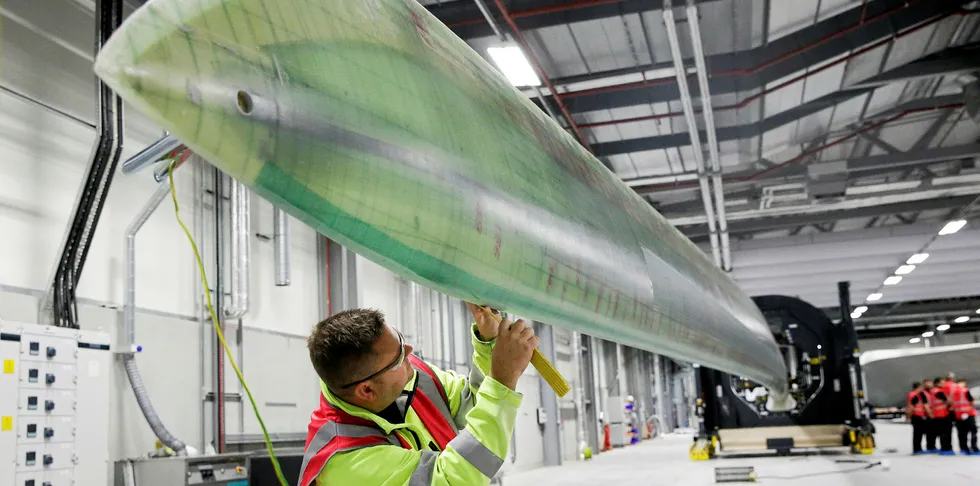 Quality control checks on a rotor blade before painting at Siemens Gamesa's plant in Hull, UK, one of the early beneficiaries of development of the UK offshore wind supply chain