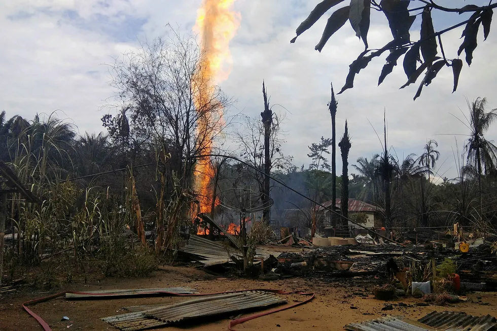 Explosion: flames from a burning oil well at a village in Aceh, Indonesia