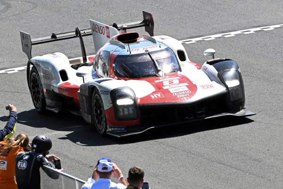Crossing the line: the Toyota number 8 GR010 Hybrid Hypercar with the drivers Sebastien Buemi, Brendon Hartley and Ryo Hirakawa win the 90th Le Mans 24 Hours endurance race
