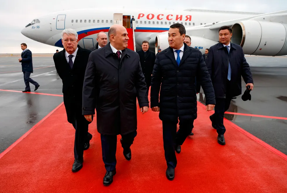 Shoulder to shoulder: Russian Prime Minister Mikhail Mishustin (front left) and Kazakhstan Prime Minister Alikhan Smailov (front right) at Astana airport.