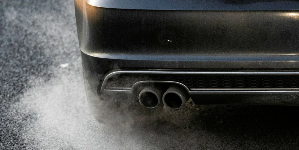 A car emits exhaust fumes on Germany's A52 Autobahn (highway)
