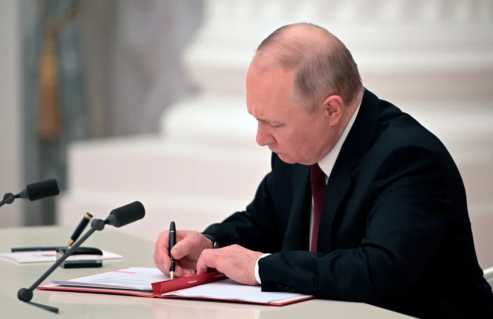 Independence recognised: Russian President Vladimir Putin signs a document on Monday recognising the independence of separatist regions in eastern Ukraine, raising tensions with the West.