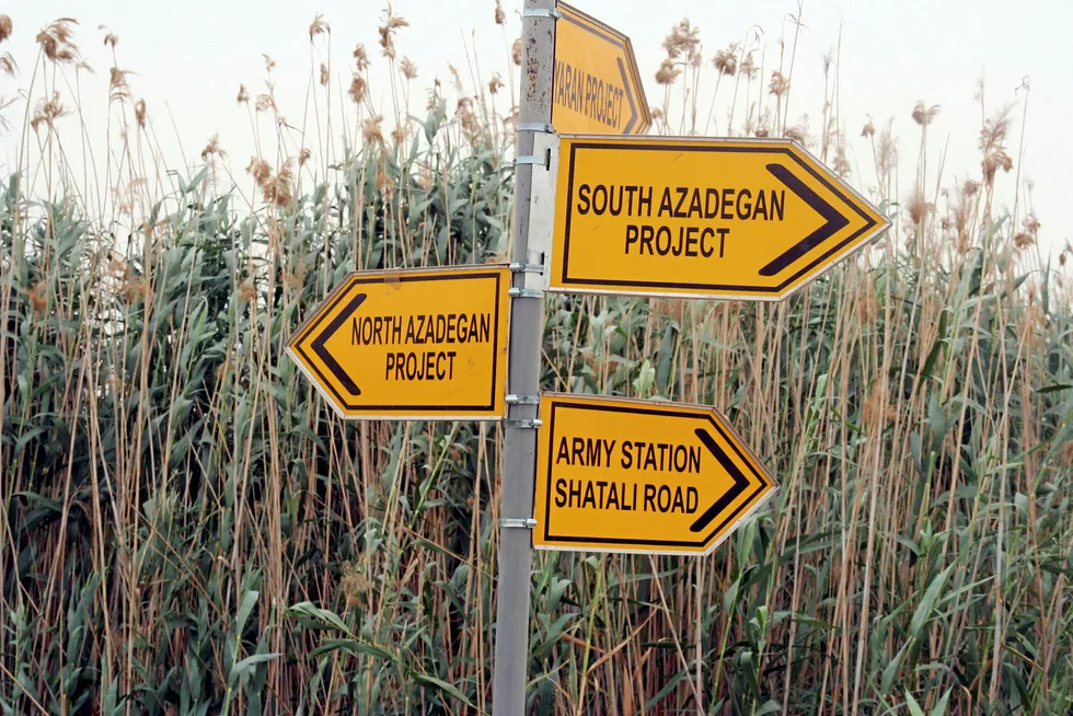 The road ahead: signs at the crossroads of Shatali Road and Ektishaf (Discovery) Road, showing directions in the South Azadegan area in Iran.