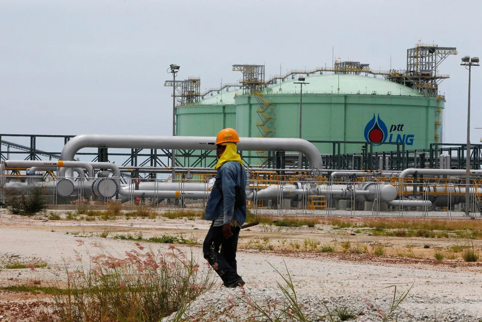 Flagship facility: an employee of national energy giant PTT outside the company's first liquefied natural gas import project at Map Ta Phut on Thailand's eastern seaboard.