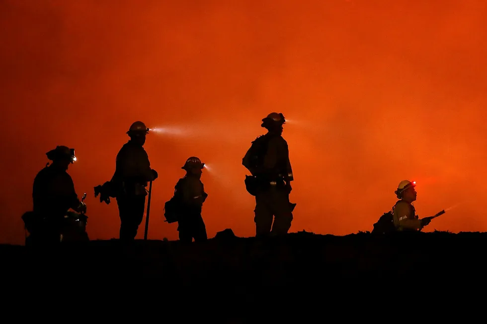 LODOGA, CA - AUGUST 07: Cal Fire firefighters monitor a back fire as they battle the Medocino Complex fire on August 7, 2018 near Lodoga, California. The Mendocino Complex Fire, which is made up of the River Fire and Ranch Fire, has surpassed the Thomas Fire to become the largest wildfire in California state history with over 280,000 acres charred and at least 75 homes destroyed. Justin Sullivan/Getty Images/AFP == FOR NEWSPAPERS, INTERNET, TELCOS & TELEVISION USE ONLY == ---