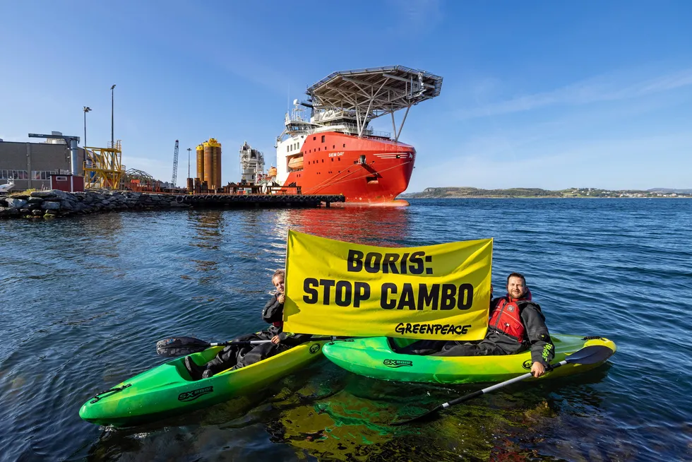 Troubled project: Greenpeace Norway activists in kayaks earlier this year confront a vessel outside Stavanger, Norway loading drilling infrastructure for the Cambo oilfield on behalf of Siccar Point Energy and Shell