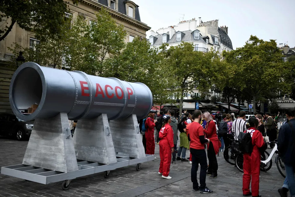Court beckons: activists gather next to a EACOP pipeline model during protests in Paris against the East African project last month.