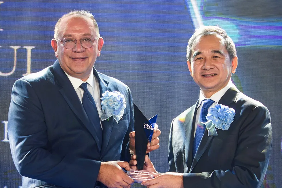 Recognition: PTTEP chief executive Montri Rawanchaikul (left) receives an award from Krisada Chinavicharana, Thailand's Deputy Finance Minister