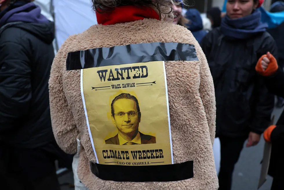 Lawsuit: An Oily Money Out demonstrator wears a poster with an image of Shell chief executive Wael Sawan during a recent London anti-fossil fuel demonstration.