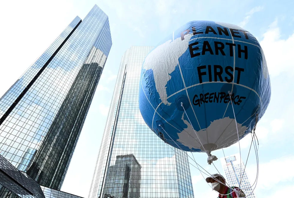 Climate protest: a balloon with the words 'Planet Earth First' at the Fridays for Future central climate strike in Frankfurt, Germany, last month, with the Deutsche Bank headquarters in the background