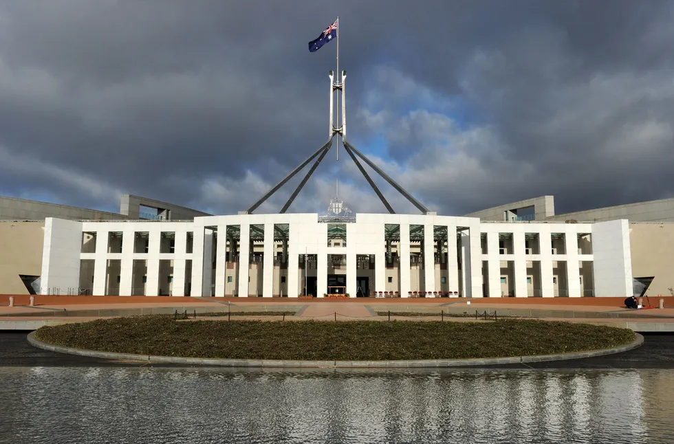 Seat of power: the Australian national flag flies over Parliament House in Canberra.