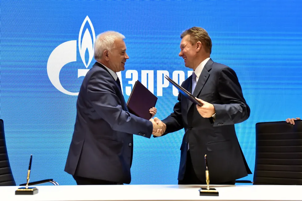 Mutual benefit: Lukoil president Vagit Alekperov, left, and Gazprom executive board chairman Alexei Miller shake hands after signing their Nenets venture plan in 2018