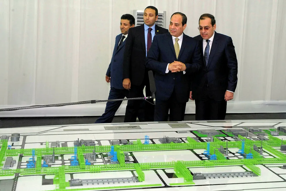 Game-changer: Egyptian President Abdel Fattah al-Sisi, centre, and Petroleum Minister Tarek al-Molla (right) looking at mockups of natural gas facilities during the inauguration of the Zohr gas field