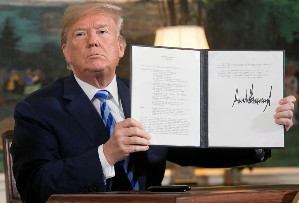 Done deal: US President Donald Trump with a document reinstating sanctions against Iran after announcing the US withdrawal from the Iran nuclear agreement