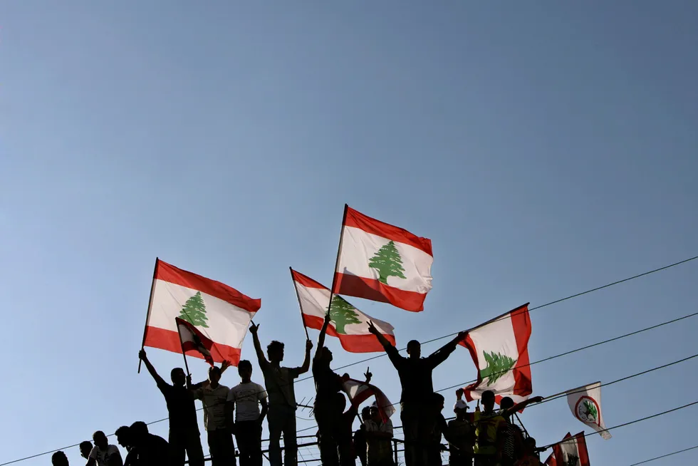 More time: Lebanese wave their national flag north of Beirut